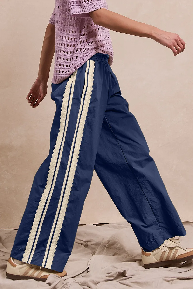 Structured fabric IB1806R-01 | SIDE CONTRAST AND LACE DETAILED TRACK PANTS WITH POCKET