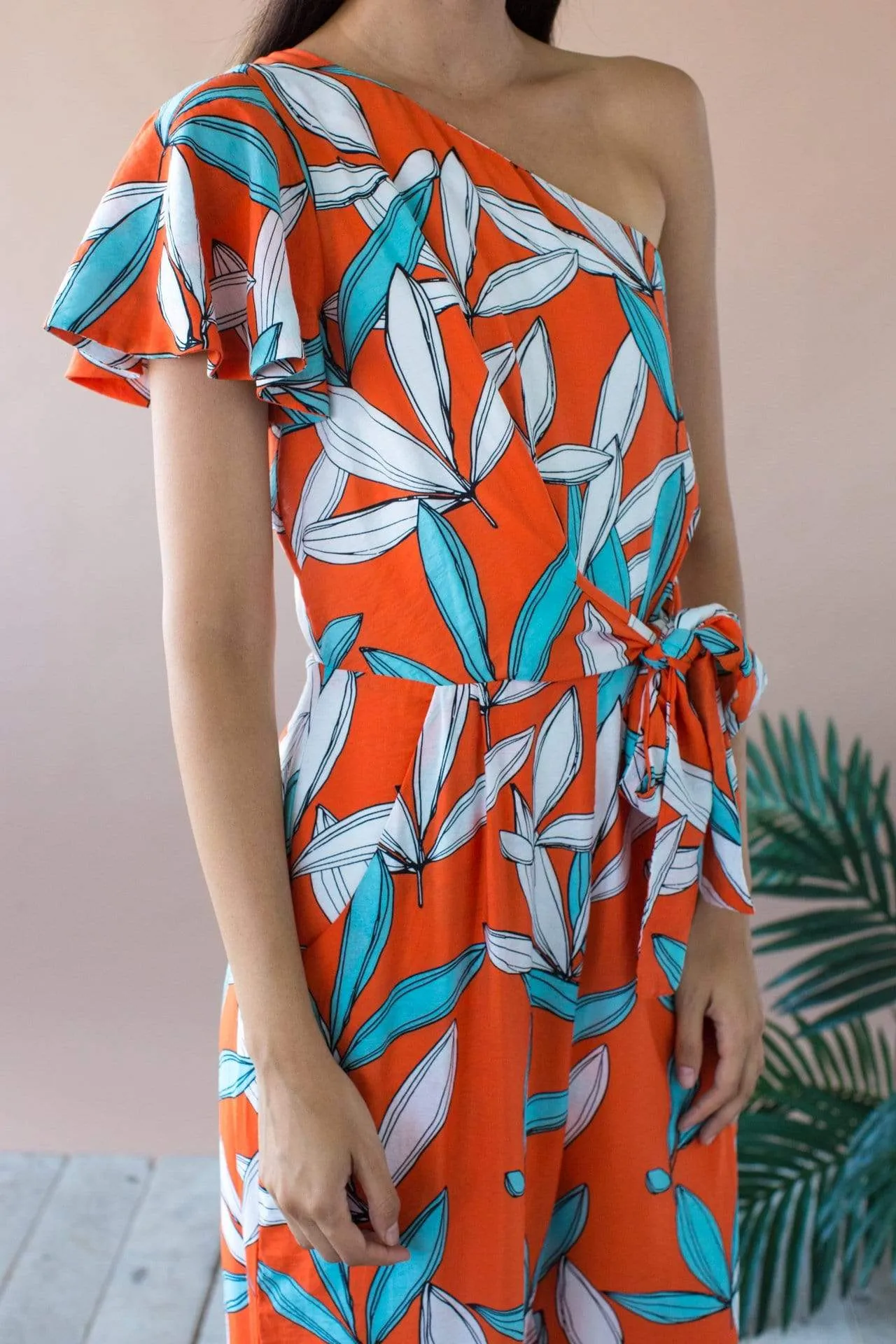 Modern Form Amir One Shoulder Jumpsuit With Flutter Sleeve and Pockets- Rio Flora