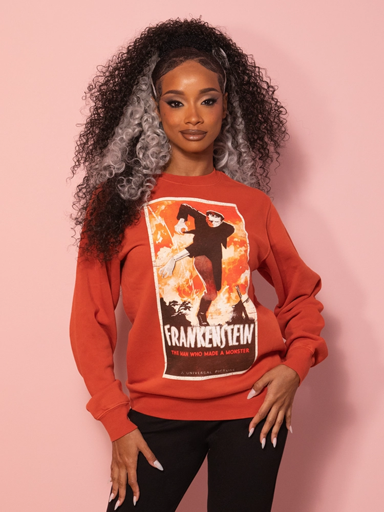 PRE-ORDER - Universal Monsters: Frankenstein Vintage Movie Poster Sweatshirt in Rust Red (unisex) Cozy Fit Draping